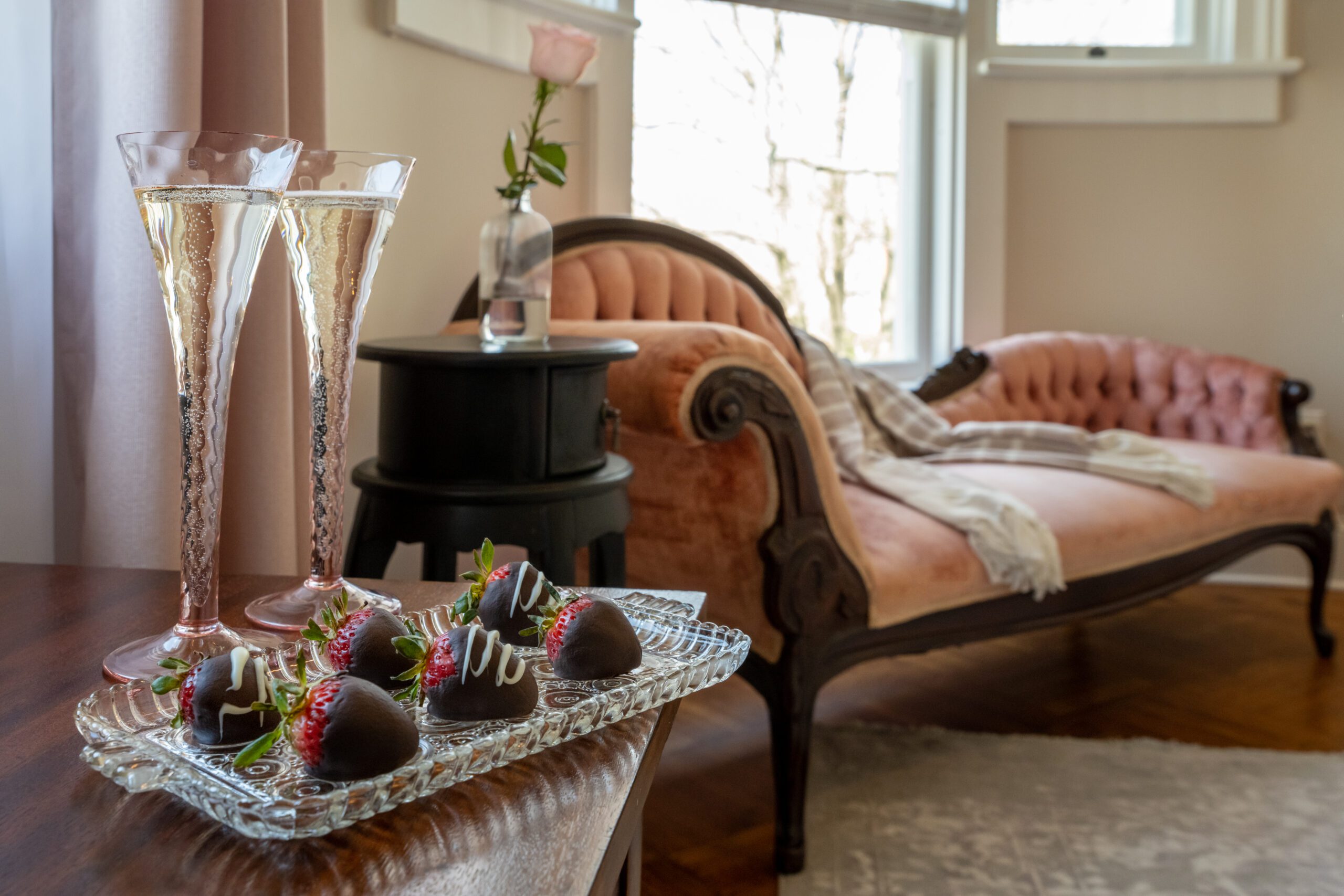 Port_Austin_Bed_and_Breakfast_Port_Austin_Hotel_Strawberries__Md - Port Austin Bed & Breakfast Image of strawberries and champagane and vintage pink sofa