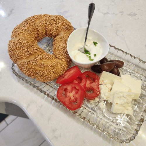 Image of Turkish Simit, olives, feta and yogurt cheese.