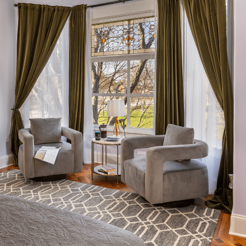 Port_Austin_Bed_and_breakfast_Port_Austin_Bed_and_Breakfast_Rooms - Port Austin Bed & Breakfast Seating area with 2 chairs table in a bay window