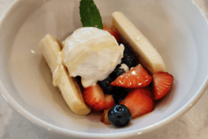 Port_Austin_Bed_and_Breakfast_Port_Austin_Michigan_Hotel_Image 17 - Port Austin Bed & Breakfast Berries, Banna and frozen yogurt in a bowl.